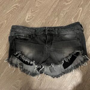 Express low rise jean shorts - size 4. Frayed at bottom